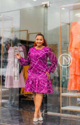 Elegant purple shift dress with ruffled hem